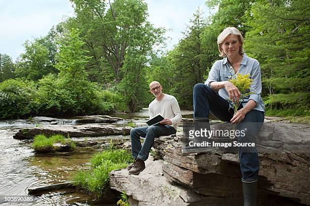 mature couple outdoors in rural scene - rural scene photos et images de collection