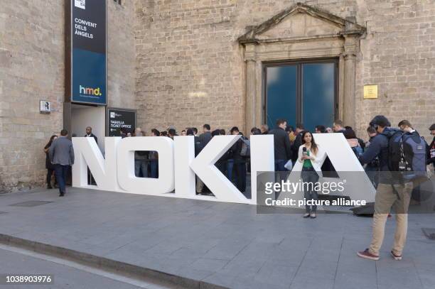 Journalists and experts at the Mobile World Congress in Barcelona, Spain, 26 February 2017. HMD Global acquired the rights to Nokia and was...