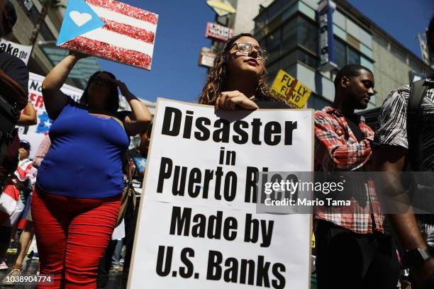 Activists rally calling for support of Puerto Rico one year after Hurricane Maria devastated the island on September 23, 2018 in Los Angeles...