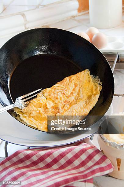 omelette in pan - omelette stock pictures, royalty-free photos & images