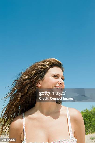 young woman with long brown hair, portrait - wavy hair stock pictures, royalty-free photos & images