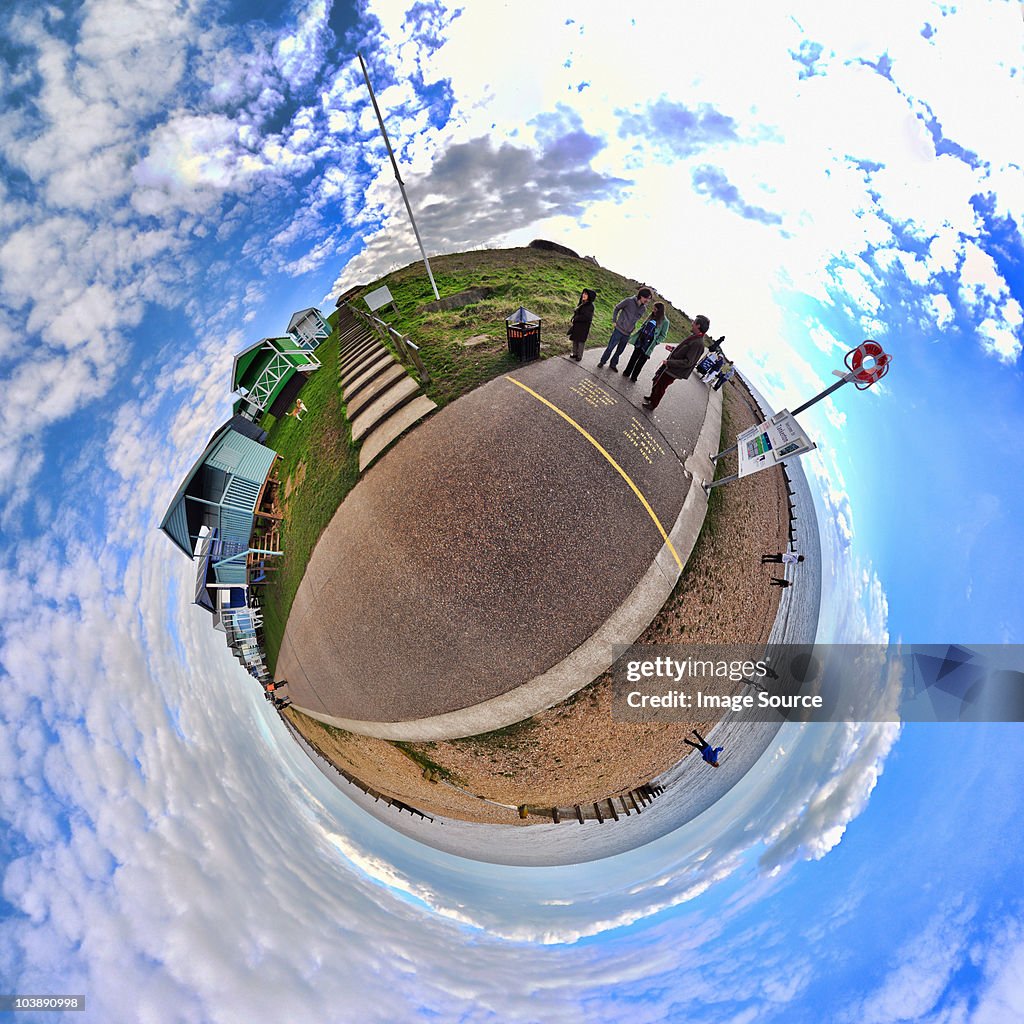 People at the seaside with little planet effect