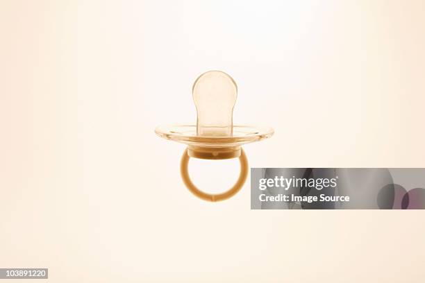 backlit pacifier - pacifier stockfoto's en -beelden