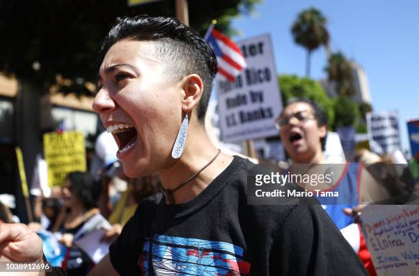 Activists march calling for support of Puerto Rico one year after Hurricane Maria devastated the island on September 23, 2018 in Los Angeles...
