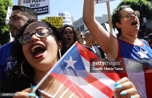 Activists march calling for support of Puerto Rico one year after Hurricane Maria devastated the island on September 23, 2018 in Los Angeles...