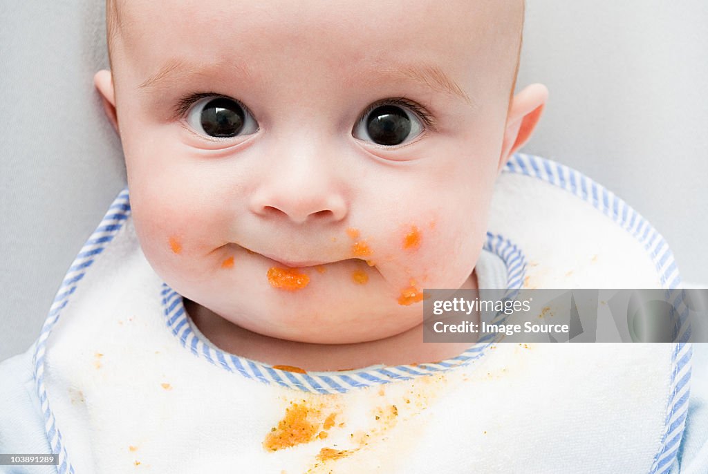 Baby with food on his face