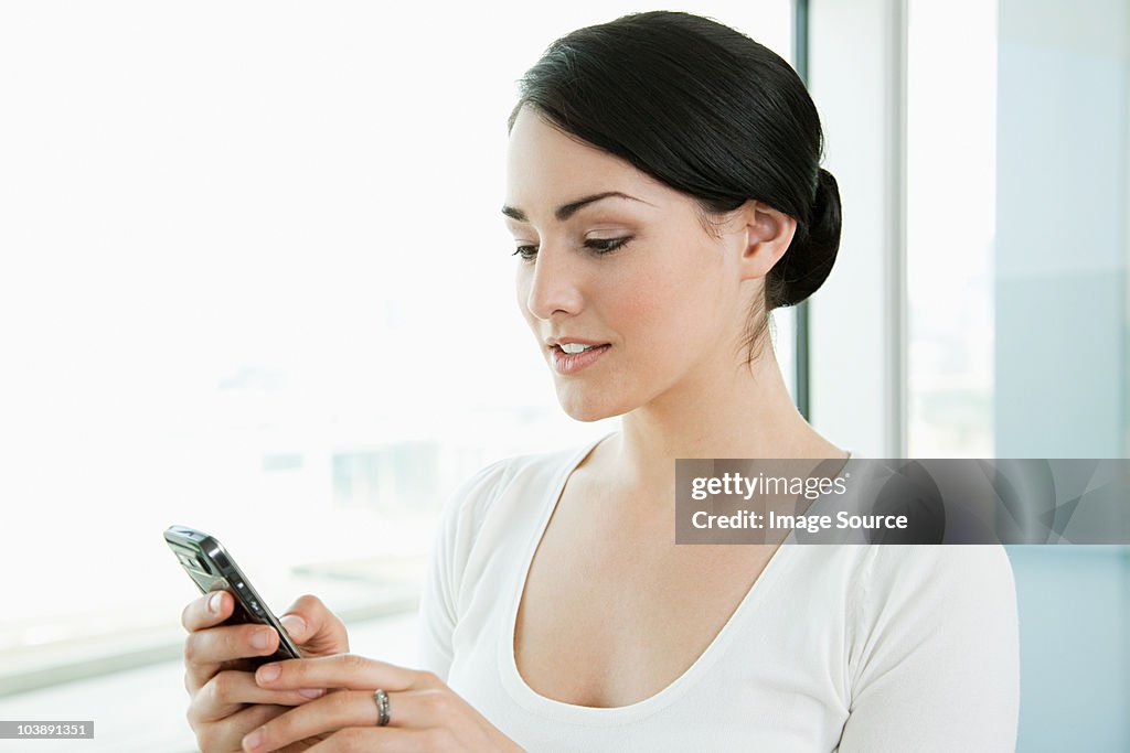 Businesswoman texting