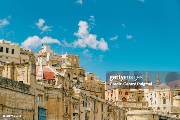 the valletta waterfront skyline seen from a boat - malta culture stock pictures, royalty-free photos & images