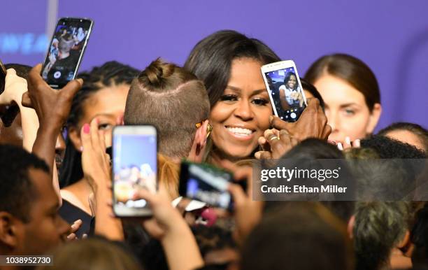 Former first lady Michelle Obama greets supporters after speaking at a rally for When We All Vote's National Week of Action at Chaparral High School...