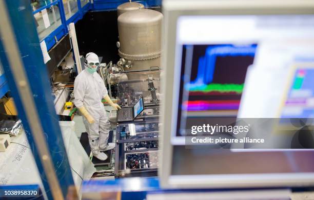 Academic assistant Emil Schreiber optimizes a subsystem in the GEO600 gravitational wave detector in Ruthe near Hanover, Germany, 11 February 2016....