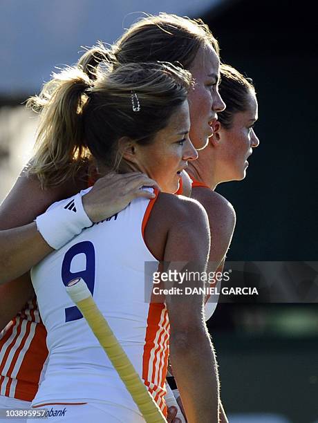 Netherlands Maartje Paumen celebrates with teammate Wieke Dijkstra and Lidewij Welten after she scored the first goal against Japan, during the field...