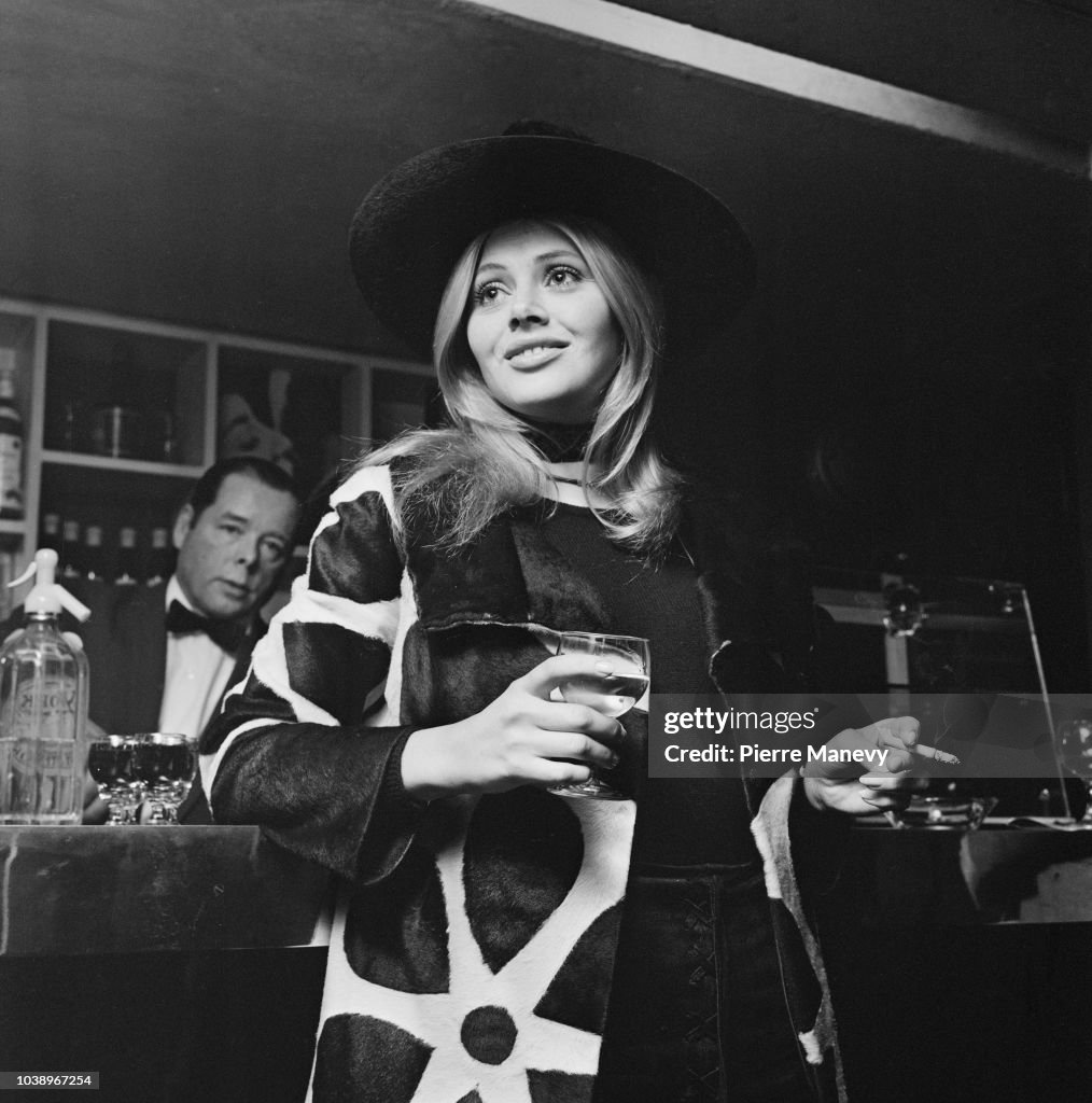 Swedish actress and singer Britt Ekland smokes a cigarette while ...