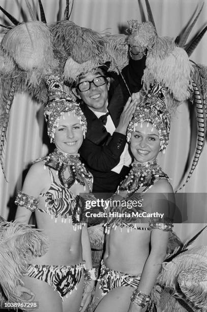 Scottish stand-up comedian, actor, writer, and broadcaster Ronnie Corbett with two cabaret dancers at the London's Savoy Hotel, UK, 20th November...