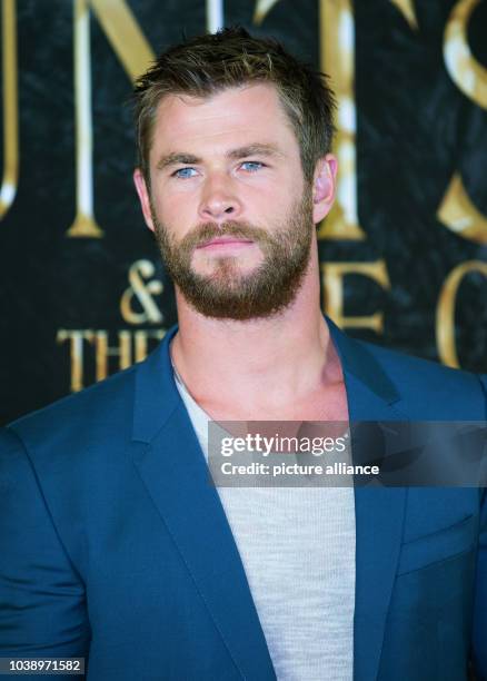 Actor Chris Hemsworth poses during a photo call for the film 'The Huntsman & The Ice Queen' in Hamburg, Germany, 30 March 2016....