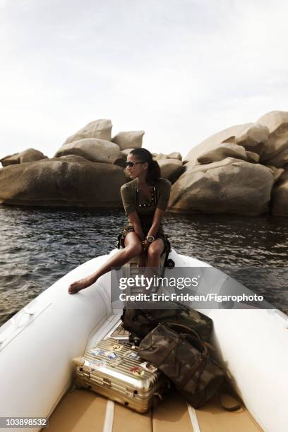 Model Noemi Lenoir at a James Bond inspired fashion session for Madame Figaro Magazine in 2009 in Corsica, France. Clothing by Gucci, sunglasses by...