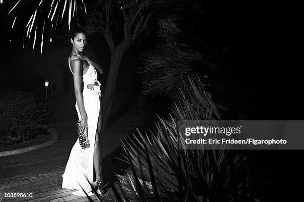 Model Noemi Lenoir at a James Bond inspired fashion session for Madame Figaro Magazine in 2009 in Corsica, France. Gown by Roberto Cavalli, ring by...