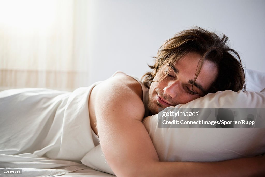 Man sleeping in bed