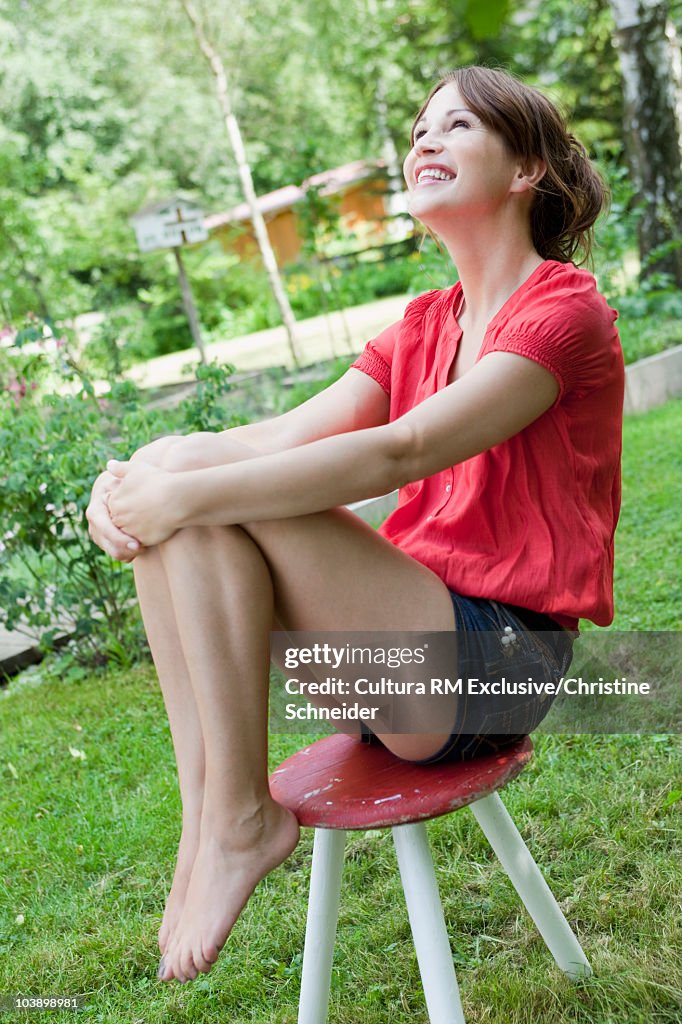 Woman enjoying the sun in the garden