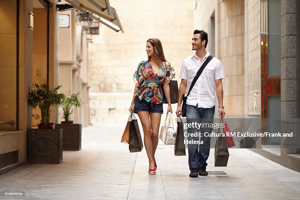 Attractive couple on shopping spree