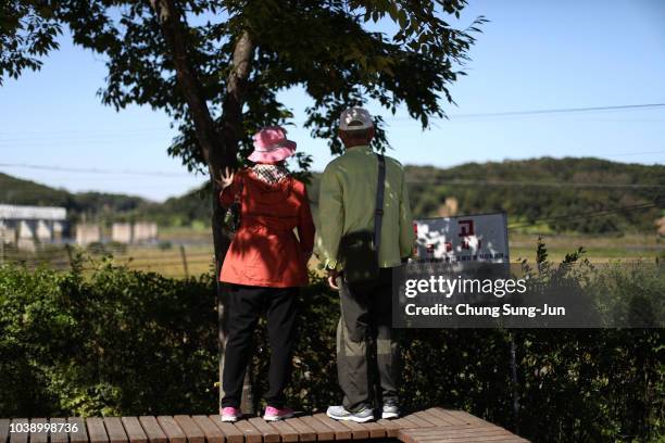 South Koreans look over a North side at the Imjingak Pavilion, near the demilitarized zone on September 24, 2018 in Paju, South Korea. Korean people...