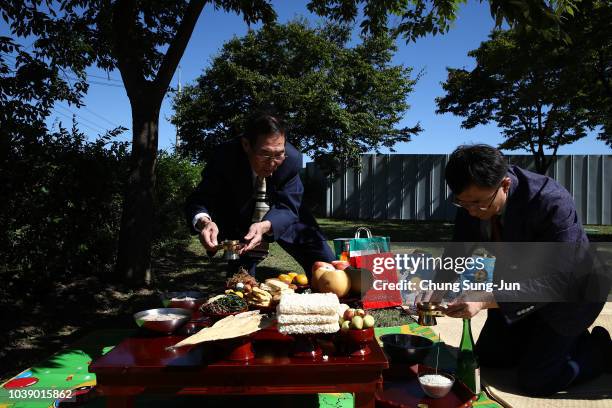 North Korean refugee Ko Ju-rak and his family members pay respects to their ancestors in North Korea during a ceremony to mark the Chuseok, the...