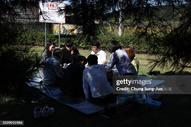 North Korean refugee Hyeon Seong-taek and his family members pay respects to their ancestors in North Korea during a ceremony to mark the Chuseok,...