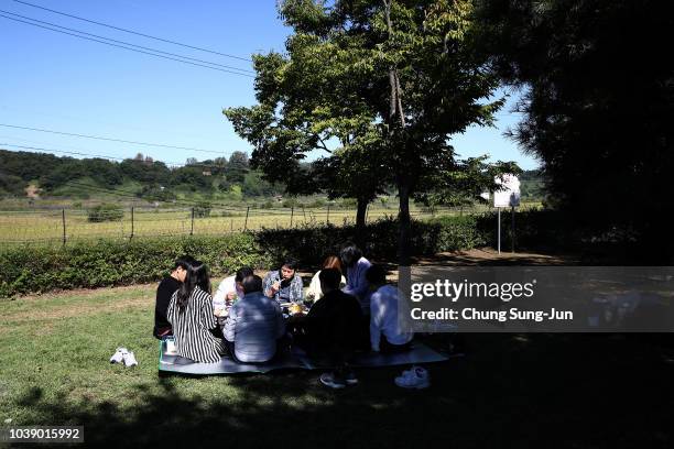 North Korean refugee Hyeon Seong-taek and his family members pay respects to their ancestors in North Korea during a ceremony to mark the Chuseok,...