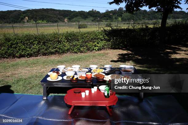 Memorial service table is prepared in front of a barbed wire fence during a ceremony to mark the Chuseok, the Korean Thanksgiving Day, at the...