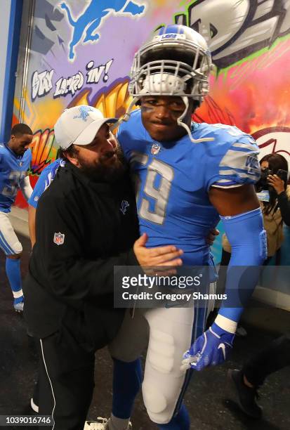 Head coach Matt Patricia of the Detroit Lions gets a hug from Marquis Flowers after a 26-10 win over the New England Patriots at Ford Field on...
