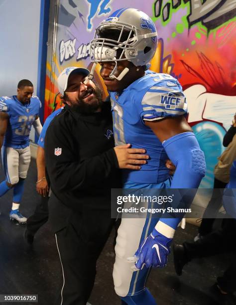 Head coach Matt Patricia of the Detroit Lions gets a hug from Marquis Flowers after a 26-10 win over the New England Patriots at Ford Field on...