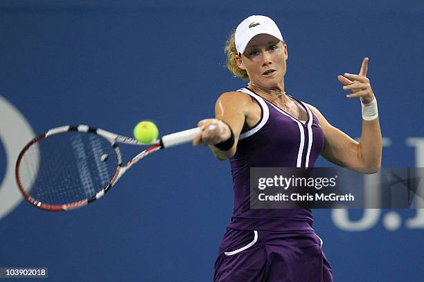 Samantha Stosur of Australia hits a return against Kim Clijsters of Belgium during day nine of the 2010 U.S. Open at the USTA Billie Jean King...