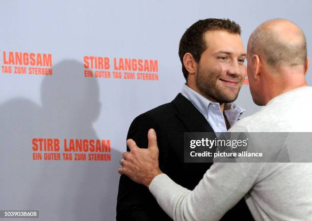 Actors Jai Courtney and Bruce Willis pose during a photocall for his new movie "A Good Day to Die Hard" in Berlin, Germany, 05 February 2013. Part...