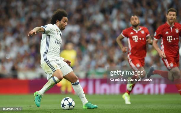 Madrid's Marcelo dribbles the ball during the second leg of the Champions League quarter final tie between Real Madrid and Bayern Munich in Madrid,...