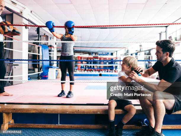 mentor & kid share a joke - boxing coach stock-fotos und bilder