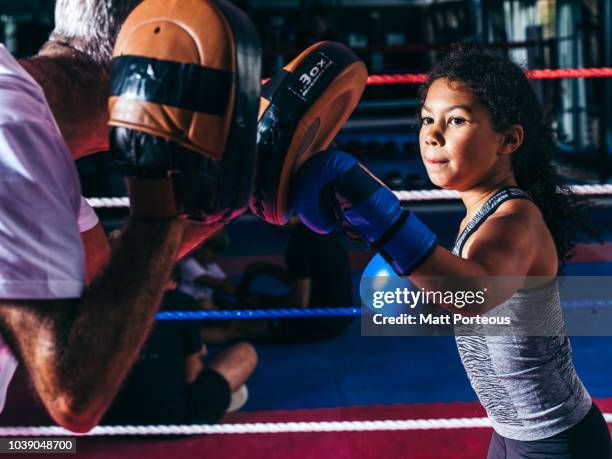 boxing mentor spars with kid - boxing ring stock pictures, royalty-free photos & images