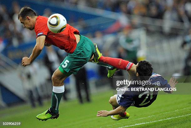 Belarus' defender Aleksandr Yurevich vies with France's midfielder Mathieu Valbuena during the Euro 2012 qualifying match France vs Belarus, on...