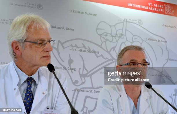 An archive picture, dated , shows head physician of the Clinic for Infectiology of the St. Georg Hospital, Bernhard Ruf and deputy physician Thomas...