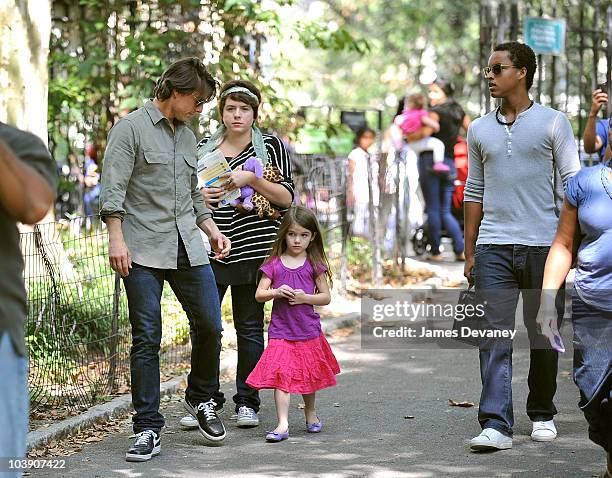 Connor Cruise, Isabella Cruise, Tom Cruise and Suri Cruise visit a Central Park West playground on September 7, 2010 in New York City.