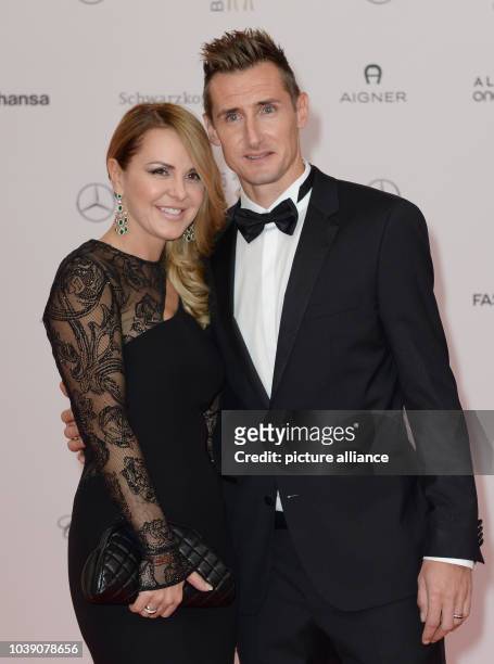 Former German national soccer team player Miroslav Klose and his wife Sylwia arrive on the red carpet before the Bambi Awards at the Stage Theater on...
