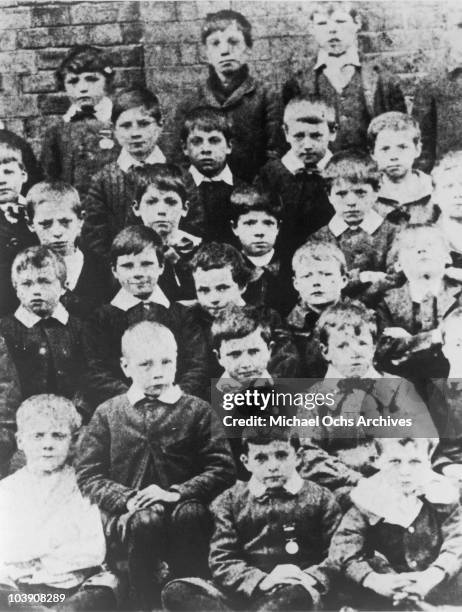 English comic actor Charlie Chaplin at age 7 with fellow pupils at Hanwell Poor Law School, London, 1897.