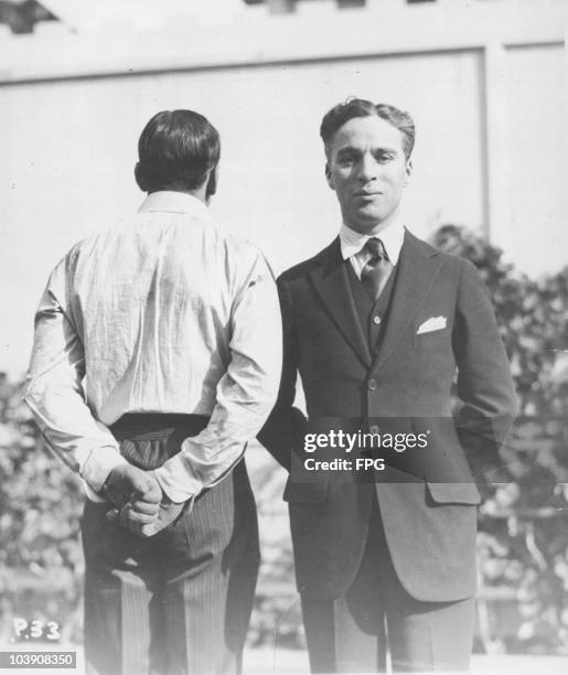 American actor Douglas Fairbanks Sr with English comic actor Charlie Chaplin , USA, circa 1920.