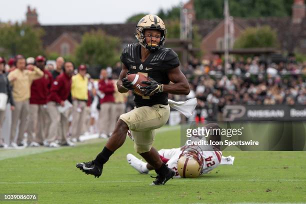 Purdue Boilermakers wide receiver Rondale Moore breaks away from Boston College Eagles defensive back Taj-Amir Torres for a 9-yard touchdown during...