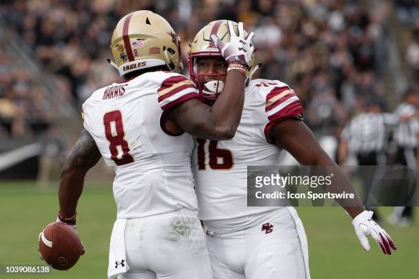 Boston College Eagles defensive back Will Harris and Boston College Eagles linebacker Davon Jones celebrate a fumble recovery during the college...