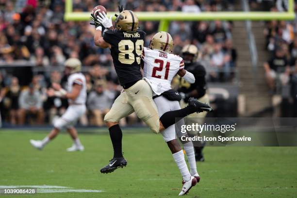 Purdue Boilermakers tight end Brycen Hopkins catches a pass defended by Boston College Eagles defensive back Lukas Denis during the college football...