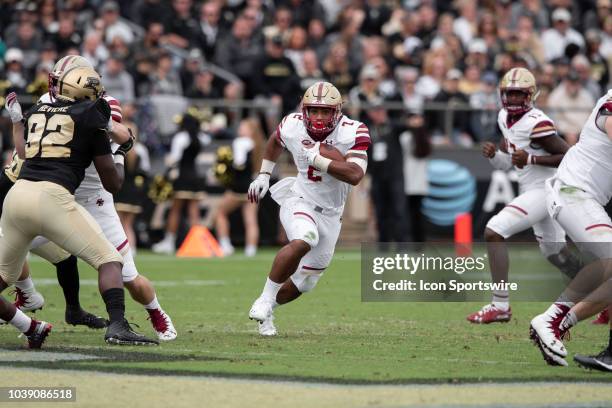 Boston College Eagles running back AJ Dillon breaks through a hole in the line during the college football game between the Purdue Boilermakers and...