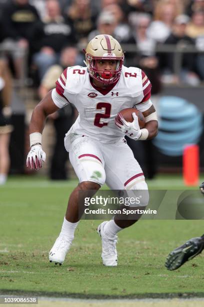 Boston College Eagles running back AJ Dillon breaks through a hole in the line during the college football game between the Purdue Boilermakers and...