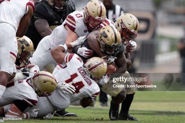 Boston College Eagles linebacker Max Richardson and Boston College Eagles defensive back Will Harris team up to stop \Purdue Boilermakers running...