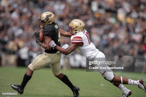 Purdue Boilermakers wide receiver Rondale Moore catches a pass defended by Boston College Eagles defensive back Brandon Sebastian during the college...