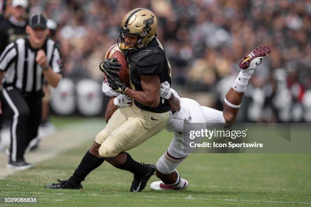 Purdue Boilermakers wide receiver Rondale Moore catches a pass defended by Boston College Eagles defensive back Brandon Sebastian during the college...