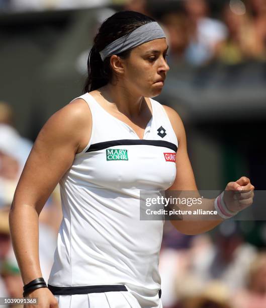 Marion Bartoli of France reacts during the women's single final match for the Wimbledon Championships at the All England Lawn Tennis Club, in London,...